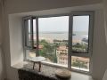 qin-chen-looks-at-the-sea-outside-guesthouse