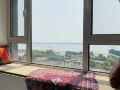 qin-chen-looks-at-the-sea-outside-guesthouse