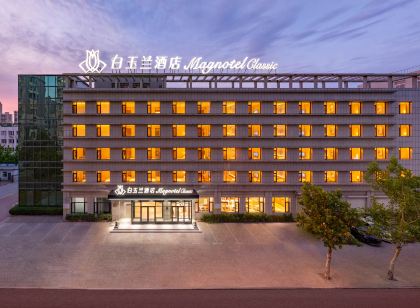 Magnolia Business Hotel ( Dalian Jinzhou Hengda Garden)