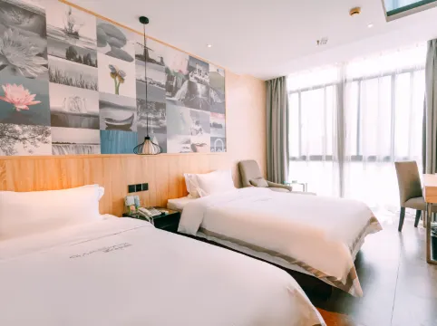 Qingmu Chain Hotel (Ma'an Shandong Railway Station Hongxing Meikailong RT-Mart)