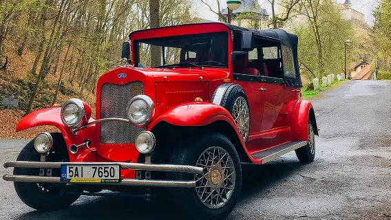 Karlstejn Castle in Vintage Convertible Car