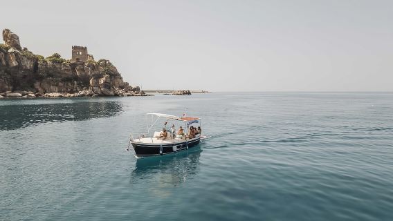 Day trips along the coast of Cefalù with swimming, snorkeling, and aperitif