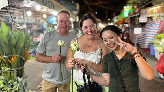 Private tour out of sight Saigon by night and authentic street food by motorbike and scooter