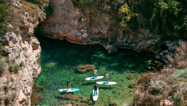 Small group paddle boarding tour to Bagni Regina Giovanna 