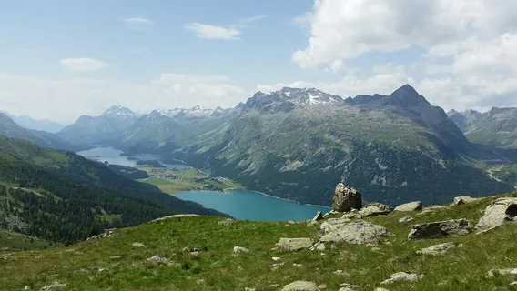 Lake St. Moritz with the Swiss alpine resort town of St. Moritz and surrounding mountains