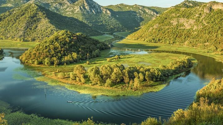 Depart from Kotor to explore Montenegro's highlights: Lovćen Mountain, Krupa River, and Sveti Stefan Island