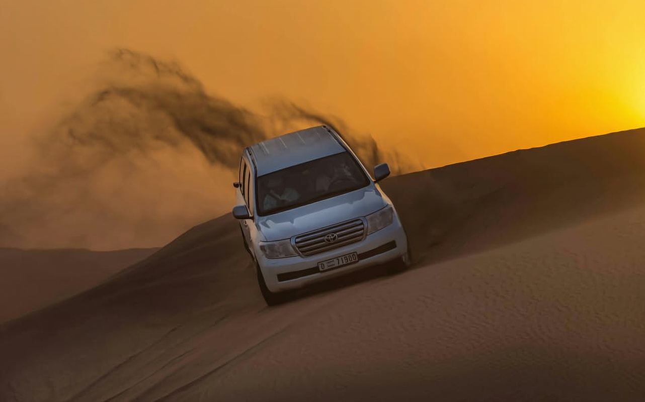Qatar: Sunset Desert Safari with Camel Ride & Sandboarding