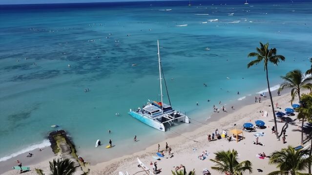 Board from Waikiki Beach for a scenic Sunset Sail on the Hāwea