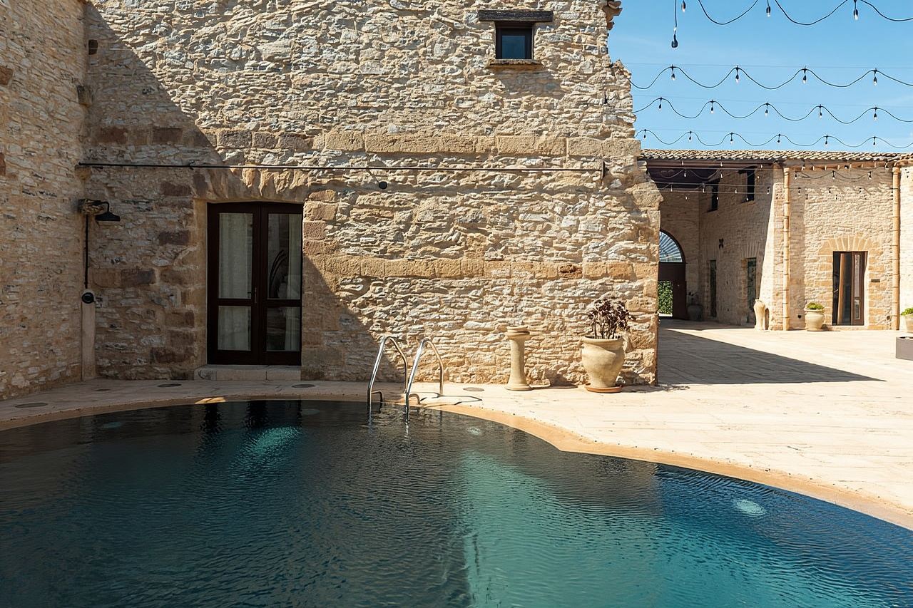 Nature and relaxation by the pool at Baglio Passofondo Estates