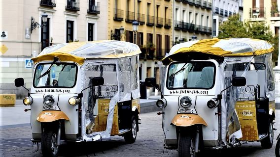 Tour of Historic and Modern Madrid with a guide in a yellow tuk tuk