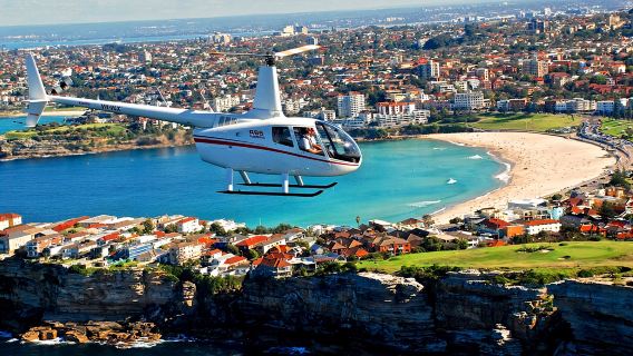 Sydney helicopter sightseeing tour [city meeting point transfers/fly over Harbour Bridge and Sydney Opera House + professional commentary + optional shared/private charter]