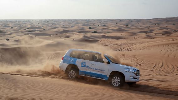 Abu Dhabi desert safari with BBQ, camel ride and sandboarding
