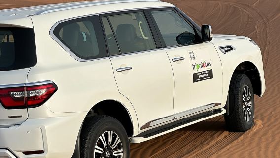 Desert Safari BBQ dinner, Camel ride & sandboarding from Dubai