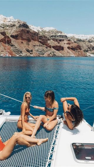 Elegant catamaran cruise in Santorini, Greece: Aegean Sea with BBQ dinner/16-person group