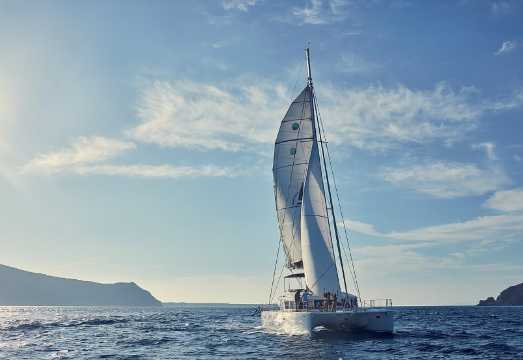 Santorini Sunset Luxury Sailing Catamaran Cruise with BBQ, Drinks and Transfer
