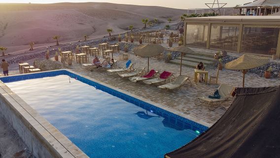 Giornata intera nel deserto: quad, cammello, cena e spettacolo o giornata in piscina e pranzo