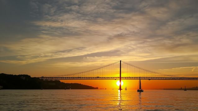 Small-group Lisbon sunset sailing cruise with a welcome drink