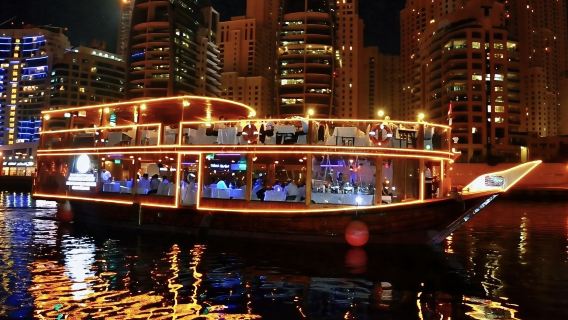 Dubai Creek cruise - New city classic night tour featuring a traditional double-decker wooden boat with dining, transfers, and performances included
