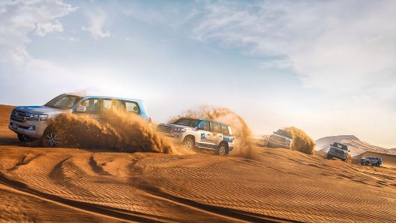 ทัวร์กลุ่มเล็กในทะเลทรายอาบูดาบี (อาหารค่ำบาร์บีคิว + ขี่อูฐ + สโนว์บอร์ด + ไป-กลับ)