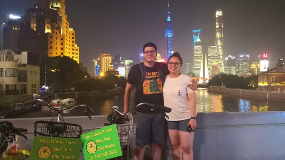 Explore Shanghai Nights: 4-Hour Bike Tour with Food Tasting