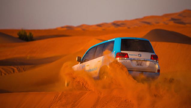 Red Dunes Desert Safari and Camel Ride with BBQ at Al Khayma Camp