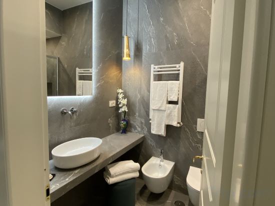 Unicum Trastevere Suites - Tap to explore photos