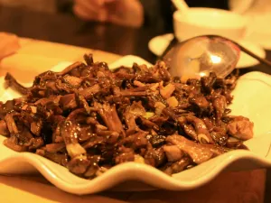 Stewed river fish in an iron pan