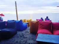 Chilling on the bean bags by the beach