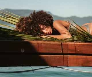 Beach beauties hang out naked below the sun