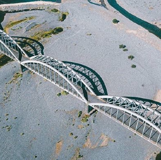 #tripaway Zog Bridge is a better thing for its architectural structure. The style of the arches gives it museum value. It is located on the right side of the road that leads to Mirdita, on both extremes of the Mat River, since 1927. called for many years the Bird Bridge, the king himself was the originator of the construction of this multifunctional bridge, especially for the right time. In those years it was a necessary gate to enter the upper Albania that causes Shkodra, Lezha, Mirdita, Tropoja, Kukes, Puka, etc. The bridge was designed by an Italian engineer Martini and almost the entire material base was solved by the Italians. The project was implemented by an Albanian engineer, Gjovalin Gjadri, an engineer who has designed a car in Milot-Burrel, which passes through the Turku meadow through Mirdita. According to the press of the time, bridge is a game within a year and is distinguished for its grandeur.
Vasha Bridge is located on the Mat River between Klosi and the village of Guri i Bardhë, 200 m linear from Arbër road.

Built at the beginning of the 18th century as a charity work by Haxhi Hajrulla Skura.

The bridge is built of limestone and has an arch on the right side and a discharge window.


Also, the bridge has double arches. The foot of the bridge is set on two rocky shores.

The length of the bridge is 11m, its height from the water surface is 7m, the width 2.8m and the distance between the two legs is 7m.


The surface of the bridge is paved with river cobblestones, lime mortar and stone blocks.

Vasha Bridge is visited by many Albanian and foreign tourists, even a small sign saying "Vasha Bridge" is placed by Czech tourists.

To enable tourists to visit the Bridge, a road should be opened from Arbër road to the monument, a cost not too high due to the proximity to the road.


This bridge carries great historical but also architectural values, moreover in a magnificent natural landscape.
Vasha Bridge is one of the oldest bridges of this style built 
#tripaway