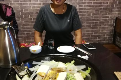 Stewed river fish in an iron pan