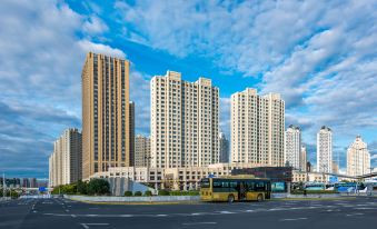 The city features tall buildings and a deserted street, along with other elements at Metropolo Jinjiang Hotel (Harbin Haxi High-speed Railway Station Wanda Plaza)