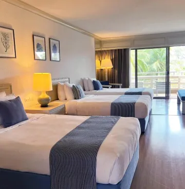 ห้องพักได้ 3 คนสไตล์เริ่มต้นที่มีวิวสวน