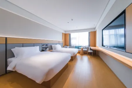 JI Hotel (Hegang City Government People's Service Center) Отели рядом с достопримечательностью «Zhenxing Square»