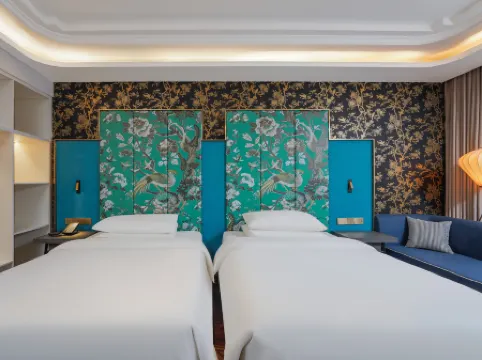 Jinjiang Metropolo Hotel (Korla Peacock River Loulan Never-Night City)