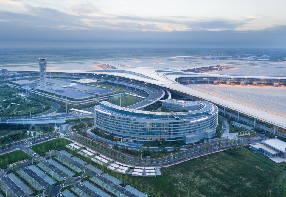 The new stadium, situated in a prominent urban area, has been meticulously designed to resemble a modern architectural masterpiece at Grand Barony Qingdao Airport Hotel