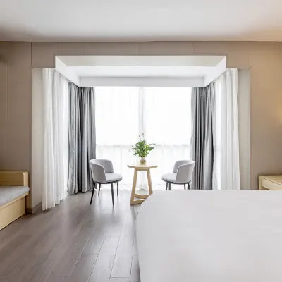 Yizhou Hotel Hotel dekat Stasiun Metro Qibao