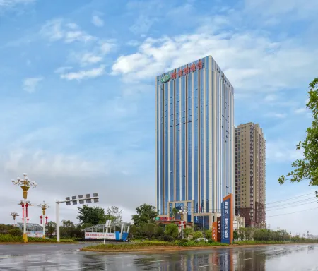 Vienna Hotel (Xingren Hotel) Отели в г. Синжэнь