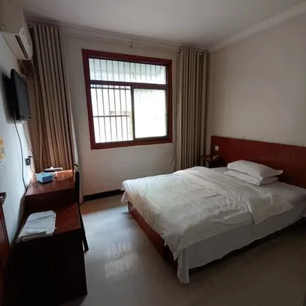 Funan Xinli Hotel Отели в г. Фунань