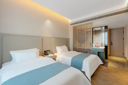 Xinzitan Business Hotel Отели рядом с достопримечательностью «Xiurong College»