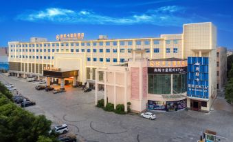 "A large building with an exterior view and the word ""hotel"" displayed on top is located in front" at OSK International Hotel