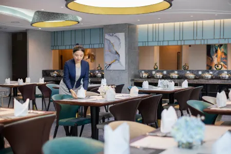 Xiamen Xinan Yihao Hotel (Xiamen Railway Station MixC Store) Отели в г. Сямэнь