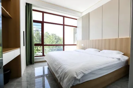 Xinxin Modern Light Luxury Homestay Отели рядом с достопримечательностью «Northeast All Day Mall»