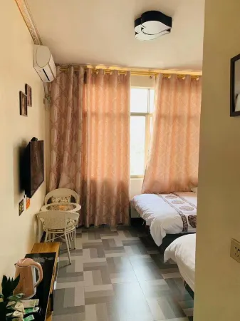 Huanjiang Sanqiao Hotel Отели рядом с достопримечательностью «Guangxi Mulun Nature Reserve»