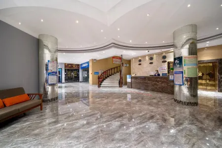 Mudanjiang Jili Hotel (Train Station Department Store) Отели рядом с достопримечательностью «Heilongjiang Child Normal University Gaodeng Zhuanke School»