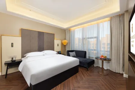 Jinjiang Metropolo Hotel (Xinyang Railway Station Xiya City) Отели рядом со станцией Xinyang East Railway Station