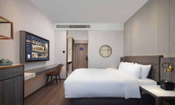 a spacious bathroom with a bathtub and a separate shower at Peony Hotel(Mudanyuan Subway Station)