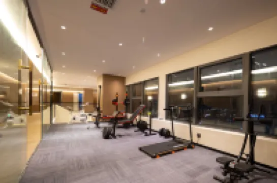 Bairan Private Hot Spring Smart Cinema Design Hotel (Xingyi Jushan Square Huijin Center) โรงแรมในซิงอี้