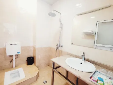 Jiulong Hotel Отели рядом с достопримечательностью «Qingniu Baima Square»