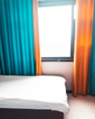 Zhoukou Kaixinyuan Hotel (Baicheng Railway Station)